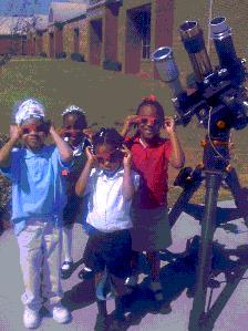 Children with a telescope
